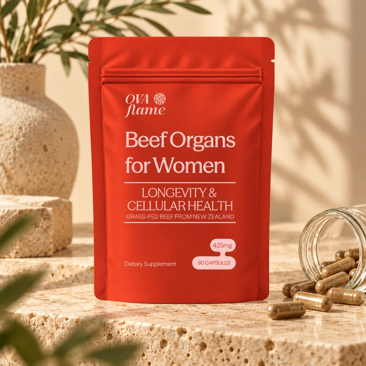 OVA flame Longevity & Cellular Health – pouch beside a tipped glass jar spilling capsules
