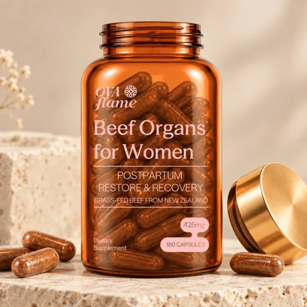 OVA flame Postpartum Restore & Recovery – amber glass bottle, open, gold lid beside it, loose capsules